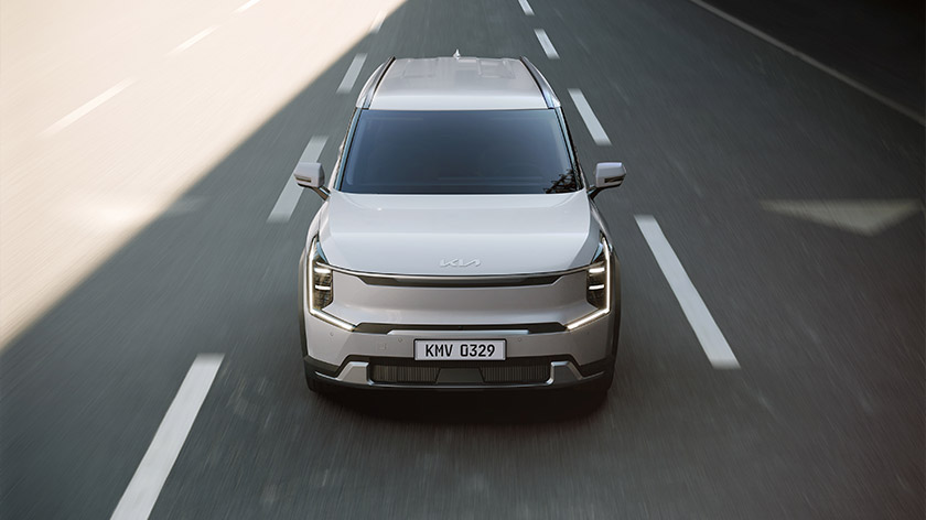 Front view of Kia EV9 driving on a road