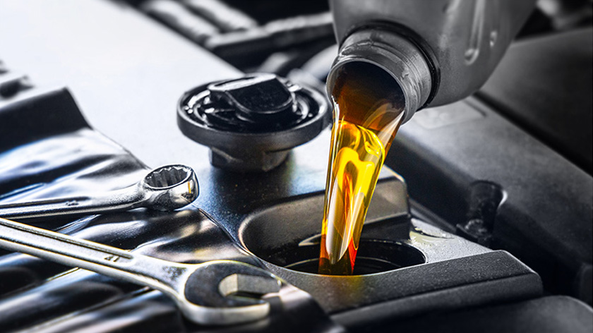 Close-up of engine oil being poured